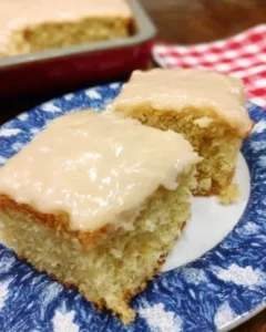 Delicious slice of Buttermilk Texas Sheet Cake with frosting and sprinkles