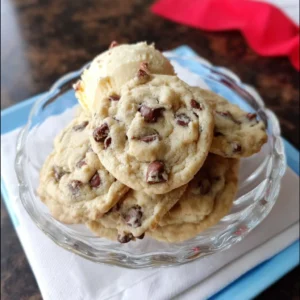 Delicious ice cream chocolate chip cookies with melted chocolate and ice cream scoop