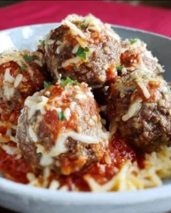 Delicious mozzarella stuffed homemade meatballs on a plate.